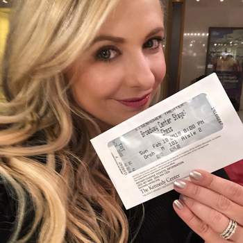 Sarah Michelle Gellar holding a ticket for Chess at the Eisenhwer Theatre